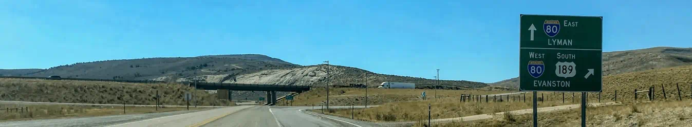 Interstate directional signs before an onramp near Evanston, Wyoming