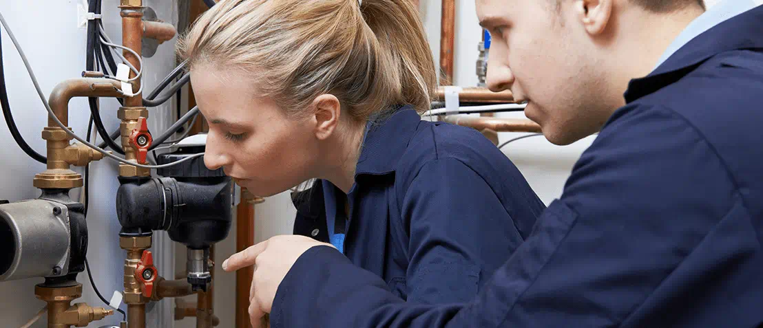 Plumber working on a water heater