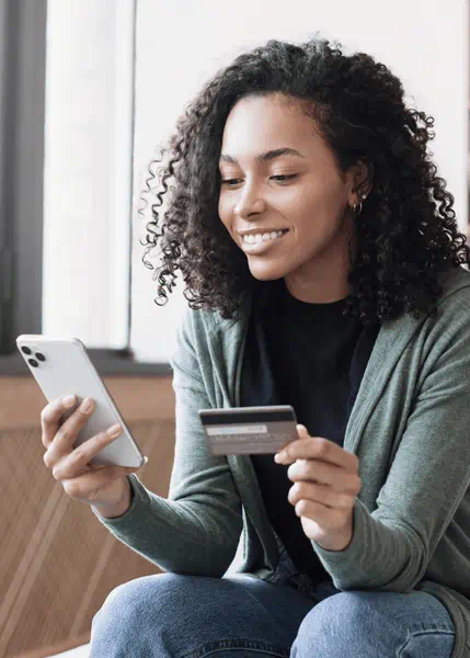 Lady holding credit card and phone