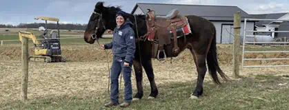 Enbridge Gas Ohio customer service representative Jody Shaw holding a horse