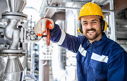 An engineer worker standing by pipes