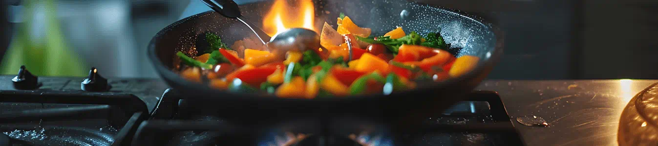 Girl cooking on gas stove