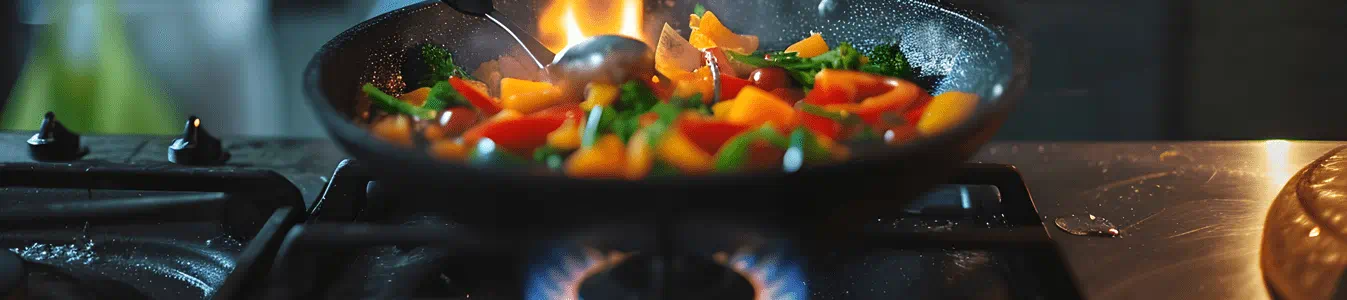 Girl cooking on a natural gas stove.