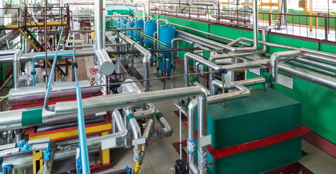 Overhead view of industrial boiler room.