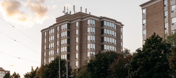 Exterior of two multi-storey residential buildings.