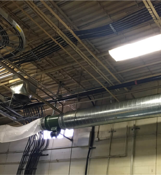 Pipes and vents on ceiling of factory building