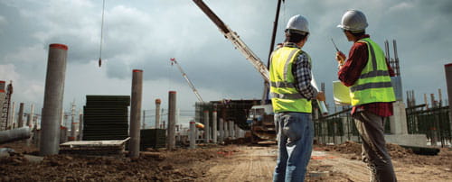 Two construction managers on a worksite