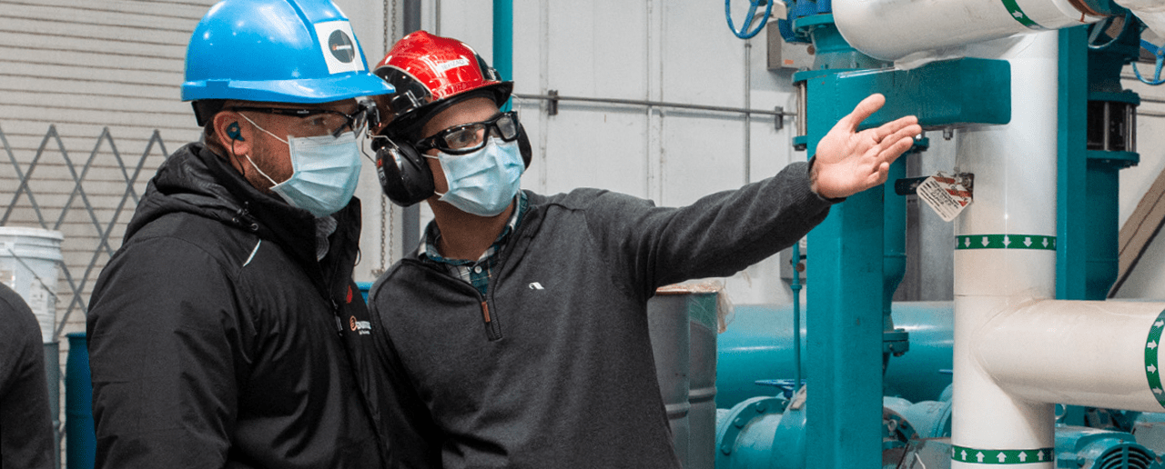 Enbridge Gas employee and Maple Leaf Foods employee touring the plant