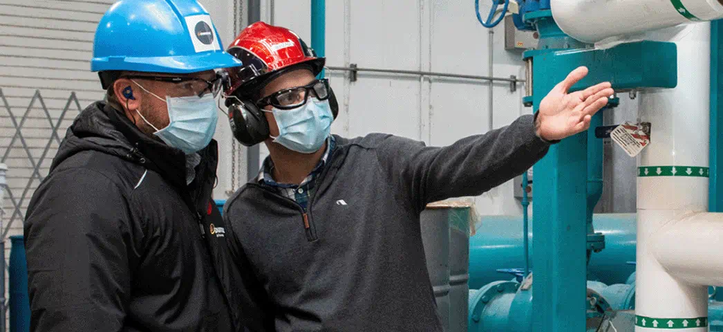 Enbridge Gas employee and Maple Leaf Foods employee touring the plant