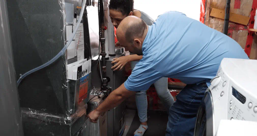 Technician inspecting heating equipment.