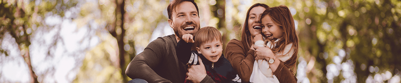 A young family posing for a picture