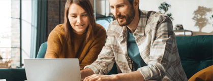 Couple reviewing their eBill on their laptop