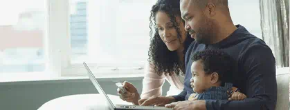 Family sitting around the computer